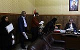 Syrians queue up in the office of Judge Mahmoud Al-Maarawi (R), who heads the religious court that oversees personal status issues for Syria's Sunni Muslims, to get official documents related to their marital affairs, such as legal papers for divorce or for second marriages in Damascus, March 8, 2016. (AFP PHOTO / LOUAI BESHARA)