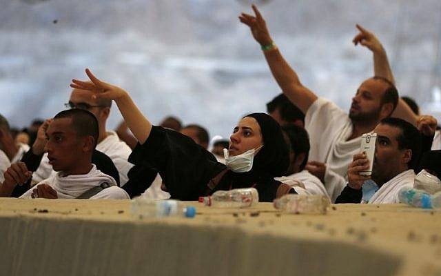 Muslim pilgrims throw pebbles at pillars during the "Jamarat" ritual, the stoning of Satan, in Mina near the holy city of Mecca, on September 12, 2016. (AFP PHOTO / AHMAD GHARABLI) Muslim pilgrims throw pebbles at pillars during the "Jamarat" ritual, the stoning of Satan, in Mina near the holy city of Mecca, on September 12, 2016. (AFP PHOTO / AHMAD GHARABLI)