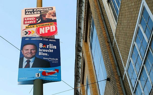 Election posters of the right extremist NPD (top) and the populist AfD parties for regional elections in Berlin are seen in Berlin's Schoeneweide district on August 15, 2016. (AFP PHOTO / Yann Schreiber) Election posters of the right extremist NPD (top) and the populist AfD parties for regional elections in Berlin are seen in Berlin's Schoeneweide district on August 15, 2016. (AFP PHOTO / Yann Schreiber)