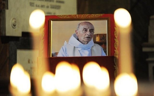 This file photo taken on August 17, 2016 shows a picture of slain Father Jacques Hamel displayed inside the church of San Luigi dei Francesi in downtown Rome. (AFP Photo/Marco Zeppetella) This file photo taken on August 17, 2016 shows a picture of slain Father Jacques Hamel displayed inside the church of San Luigi dei Francesi in downtown Rome. (AFP Photo/Marco Zeppetella)