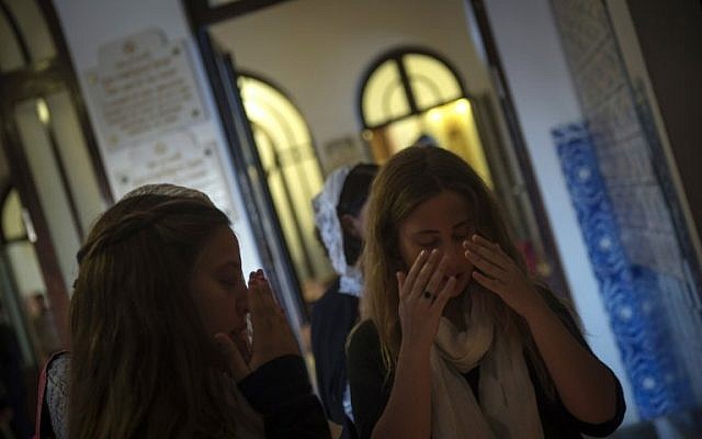 Members of the Jewish Community of Porto gesture as they arrive at the Kadoorie Mekor Haim Synagogue in Porto, on September 2, 2016 before the Shabbat celebrations. (AFP PHOTO / MIGUEL RIOPA)