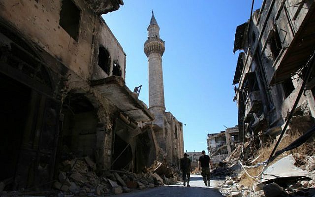 Syrian government soldiers walk in the damaged al-Farafira souk in the government-held side of Aleppo's historic city center on September 16, 2016. (Youssef Karwashan/AFP) Syrian government soldiers walk in the damaged al-Farafira souk in the government-held side of Aleppo's historic city center on September 16, 2016. (Youssef Karwashan/AFP)