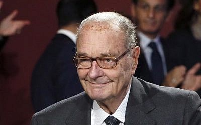 This  photo taken on November 21, 2014 shows French ex-president Jacques Chirac arriving to attend the award ceremony of the Jacques Chirac Foundation  at the Quai Branly museum in Paris. 
(AFP PHOTO / POOL / PATRICK KOVARIK)