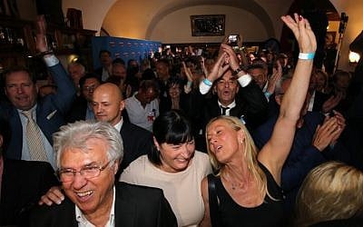Supporters of the populist AfD celebrate during the electoral evening after Berlin's state elections on September 18, 2016 in Berlin. (AFP PHOTO / dpa / Wolfgang Kumm)