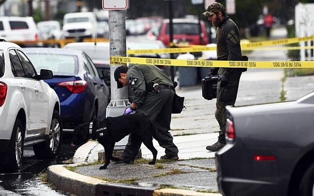 Investigators with the Federal Bureau of Investigation (FBI) leave after searching the family restaurant and adjoined apartment of Ahmad Khan Rahami in Elizabeth, New Jersey, on September 19, 2016.(AFP PHOTO / Jewel SAMAD)