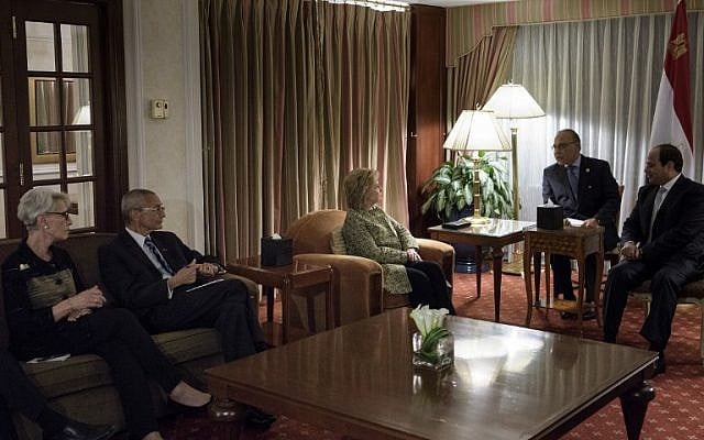 Wendy Sherman (L), a former US undersecretary of state for political affairs, and John Podesta (2L), Clinton Campaign Chairman, listen as Democratic presidential nominee Hillary Clinton and Egyptian President Abdel Fattah el-Sissi speak through an interpreter at the Palace Hotel on September 19, 2016 in New York. (AFP PHOTO / Brendan Smialowski)
