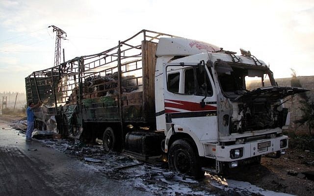The morning after a convoy delivering aid was hit by a deadly air strike a damaged truck carrying aid is seen on the side of the road in the town of Orum al-Kubra on outskirts of Aleppo, Syria, September 20, 2016. (AFP/Omar haj kadour)