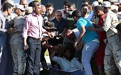 An Egyptian man reacts upon the arrival of a body along the shore in the Egyptian port city of Rosetta on September 22, 2016, during a search operation after a boat carrying migrants capsized in the Mediterranean. (AFP/Mohamed El-Shahed)