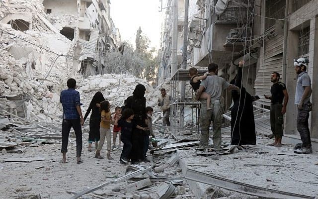 A Syrian family leaves the area following a reported airstrike on September 23, 2016, on the al-Muasalat area in the northern city of Aleppo. (AFP/Thaer Mohammed) A Syrian family leaves the area following a reported airstrike on September 23, 2016, on the al-Muasalat area in the northern city of Aleppo. (AFP/Thaer Mohammed)