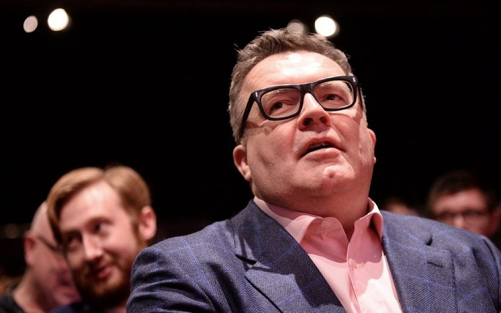 The deputy head of British Labour Party, Tom Watson, sits in the audience ahead of the Labour leadership announcement at a party conference in Liverpool on September 24, 2016. (AFP PHOTO/OLI SCARFF)