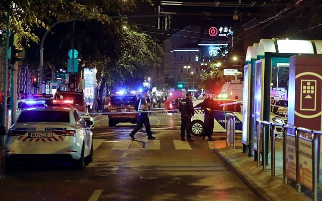 Hungarian police officials investigate in Budapest downtown as an explosion of unknown origin rocked a building late night on September 24, 2016 injuring two passing police officers.(AFP PHOTO / STR)