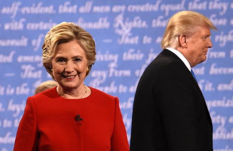 Democratic nominee Hillary Clinton and Republican nominee Donald Trump leave the stage after the first presidential debate at Hofstra University in Hempstead, New York on September 26, 2016. AFP PHOTO / Timothy A. CLARY) Democratic nominee Hillary Clinton and Republican nominee Donald Trump leave the stage after the first presidential debate at Hofstra University in Hempstead, New York on September 26, 2016. AFP PHOTO / Timothy A. CLARY)