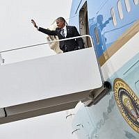 US President Barack Obama boards Air Force One at Andrews Air Force Base in Maryland on September 29, 2016 as he departs for Israel to attend the funeral of former Israeli president Shimon Peres in Jerusalem. (AFP Photo/Nicholas Kamm)