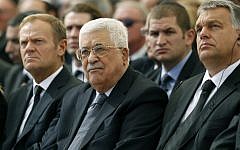 Palestinian Authority President Mahmoud Abbas, center, sits alongside European Council President Donald Tusk, left, and Romanian President Klaus Iohannis at Jerusalem's Mount Herzl national cemetery during the funeral of former Israeli president Shimon Peres on September 30, 2016. (AFP/Pool/Abir Sultan)