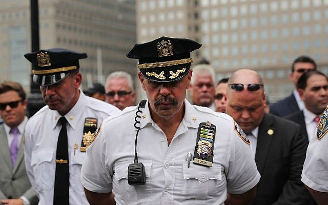 Police pause during a procession in Lower Manhattan to mark the 15th anniversary of the 9/11 attacks and the police officers who were killed during and after the event, on September 9, 2016 in New York City. (Spencer Platt/Getty Images/AFP)