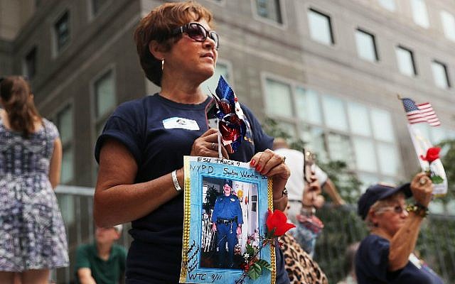Family members of fallen officers watch a procession in Lower Manhattan to mark the 15th anniversary of the 9/11 attacks and the police officers who were killed during and after the event, on September 9, 2016 in New York City. (Spencer Platt/Getty Images/AFP) Family members of fallen officers watch a procession in Lower Manhattan to mark the 15th anniversary of the 9/11 attacks and the police officers who were killed during and after the event, on September 9, 2016 in New York City. (Spencer Platt/Getty Images/AFP)