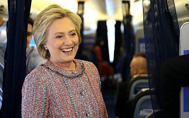 Democratic presidential nominee former Secretary of State Hillary Clinton speaks to members of the traveling press aboard her campaign plane at Westchester County Airport on September 15, 2016 in White Plains, New York. (Justin Sullivan/Getty Images/AFP)