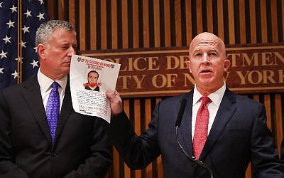 New York City police commissioner James O'Neill holds up a picture of Ahmad Khan Rahami, the man believed to be responsible for the explosion in Manhattan on Saturday night and an earlier bombing in New Jersey, at a news conference at New York City on September 19, 2016 in New York City. (Spencer Platt/Getty Images/AFP)