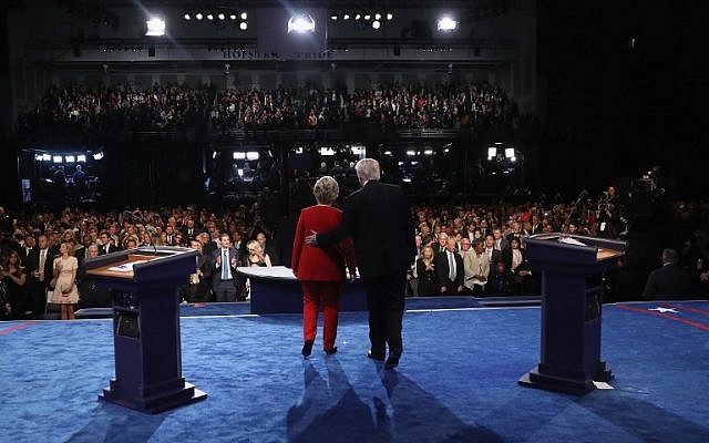 Democratic nominee Hillary Clinton and Republican nominee Donald Trump greet the audience at the end of the first presidential debate at Hofstra University in Hempstead, New York on September 26, 2016. (Joe Raedle/Getty Images/AFP)
