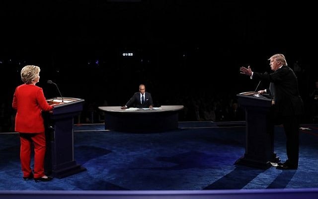 Republican presidential nominee Donald Trump speaks as Democratic presidential nominee Hillary Clintonlistens during the Presidential Debate at Hofstra University on September 26, 2016 in Hempstead, New York. (Joe Raedle/Getty Images/AFP)