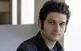 Facebook co-founder Dustin Moskovitz poses outside his office in San Francisco, April 26, 2012. (AP Photo/Eric Risberg)