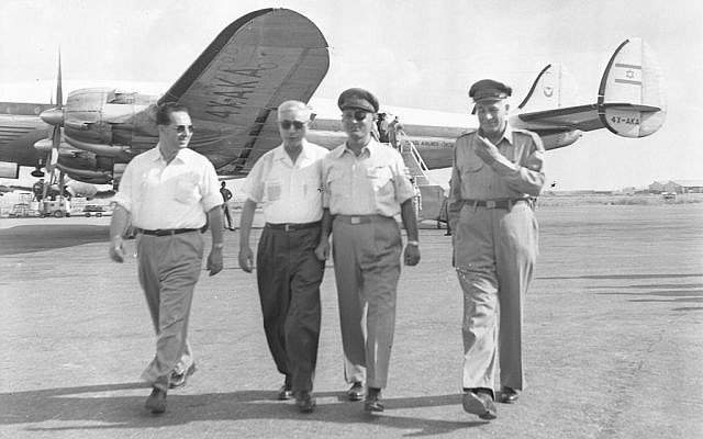 From left, then-director-general of the Defense Ministry Shimon Peres, defense minister Pinhas Lavon, IDF chief of staff Moshe Dayan and deputy IDF chief of staff Yosef Avidar on August 19, 1954. (Asaf Kutin/Bamahane/Defense Ministry Archives) From left, then-director-general of the Defense Ministry Shimon Peres, defense minister Pinhas Lavon, IDF chief of staff Moshe Dayan and deputy IDF chief of staff Yosef Avidar on August 19, 1954. (Asaf Kutin/Bamahane/Defense Ministry Archives)