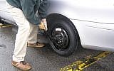 Changing a tire (CC BY robmba, Flickr)