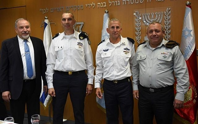 Left to right, Defense Minister Avigdor Liberman, incoming head of the Israel Navy Vice Adm. Eli Sharvit, outgoing naval commander Vice Adm. Ram Rothberg and IDF Chief of Staff Gadi Eisenkot during a ceremony in the army's Tel Aviv headquarters during which Sharvit received his new position on September 12, 2016. (IDF Spokesperson's Unit) Left to right, Defense Minister Avigdor Liberman, incoming head of the Israel Navy Vice Adm. Eli Sharvit, outgoing naval commander Vice Adm. Ram Rothberg and IDF Chief of Staff Gadi Eisenkot during a ceremony in the army's Tel Aviv headquarters during which Sharvit received his new position on September 12, 2016. (IDF Spokesperson's Unit)