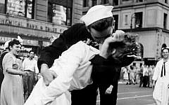 In this photo provided by the US Navy, sailor George Mendonsa and nurse Greta Zimmer Friedman kiss passionately in Manhattan's Times Square, as New York City celebrates the end of World War II, on August 14, 1945. (US Navy/Victor Jorgensen)