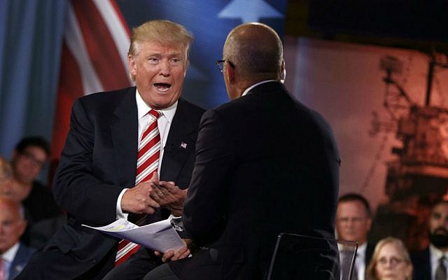 Republican presidential candidate Donald Trump speaks with 'Today' show co-anchor Matt Lauer at the NBC Commander-In-Chief Forum held at the Intrepid Sea, Air and Space Museum aboard the decommissioned aircraft carrier Intrepid, New York, Wednesday, Sept. 7, 2016. (AP Photo/Evan Vucci)