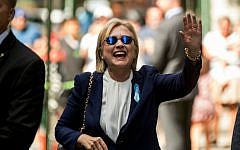 Democratic presidential candidate Hillary Clinton waves after leaving an apartment building Sunday, September 11, 2016, in New York. (AP Photo/Andrew Harnik)