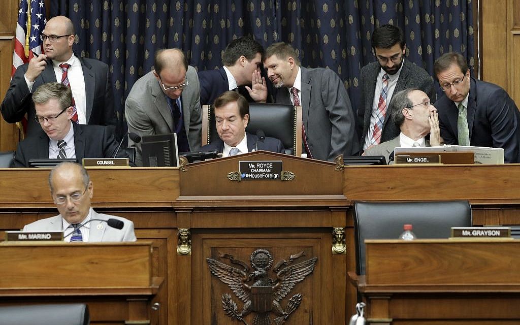 House Foreign Affairs Committee Chairman Rep. Ed Royce, center, and the committee's ranking member Rep. Eliot Engel, second from right, listen to staffers as they confer on Capitol Hill in Washington, during the committee's hearing on Iran on September 14, 2016.  (AP/Jacquelyn Martin)