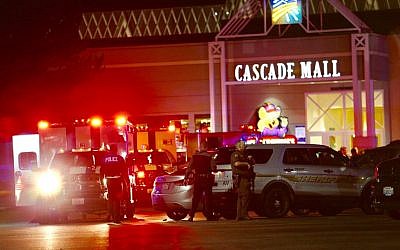 Law enforcement officers work at the crime scene outside of Cascade Mall in Burlington, Wash., where several people were fatally shot on Friday, Sept. 23, 2016. (Dean Rutz/The Seattle Times via AP)