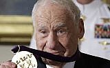 Actor, comedian and writer Mel Brooks holds up his 2015 National Medal of Arts awarded to him by President Barack Obama during a ceremony in the East Room of the White House, Thursday, Sept. 22, 2016, in Washington. (AP Photo/Carolyn Kaster)