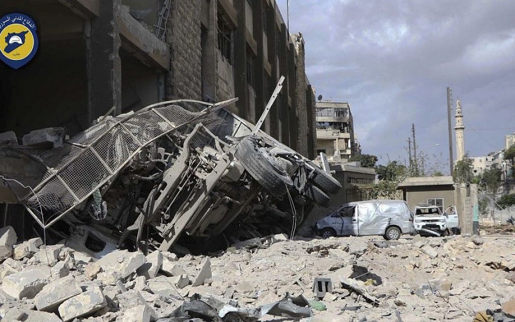 A destroyed ambulance is seen outside the Syrian Civil Defense main center after airstrikes in Ansari neighborhood in the rebel-held part of eastern Aleppo, Syria, Friday, Sept. 23, 2016. (Syrian Civil Defense White Helmets via AP)