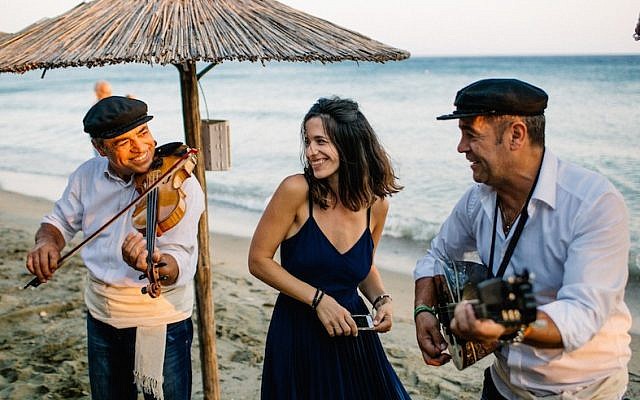 Wedaway founder and CEO Gal Zahavia sharing a moment with Greek musicians in Tinos, Greece, June 24, 2016. (We Are Red/JTA) Wedaway founder and CEO Gal Zahavia sharing a moment with Greek musicians in Tinos, Greece, June 24, 2016. (We Are Red/JTA)