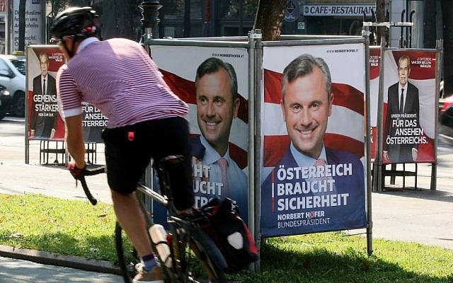 A man cycles between election posters of Alexander Van der Bellen, presidential candidate and former head of the Austrian Greens, left and right, and Norbert Hofer, candidate for Austria's right-wing Freedom Party, FPOE, center, in Vienna, Austria, Monday, Sept. 12, 2016. (AP Photo/Ronald Zak) A man cycles between election posters of Alexander Van der Bellen, presidential candidate and former head of the Austrian Greens, left and right, and Norbert Hofer, candidate for Austria's right-wing Freedom Party, FPOE, center, in Vienna, Austria, Monday, Sept. 12, 2016. (AP Photo/Ronald Zak)