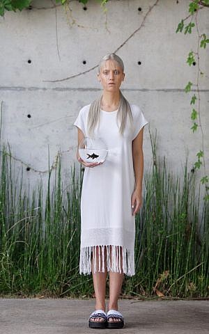 An all-white, handwoven white shift for the upcoming high holidays, made by Jerusalem artist Adi Yair (Courtesy Adi Yair)