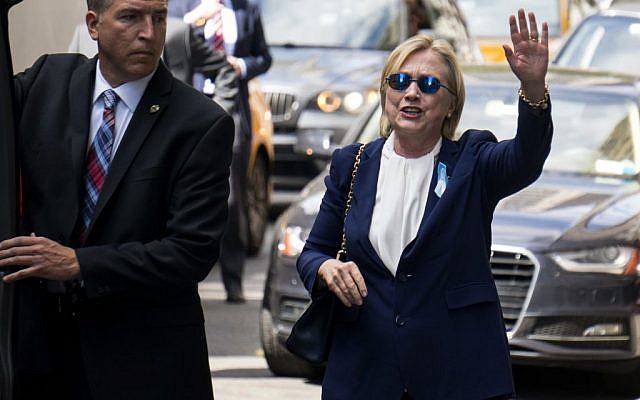 Democratic presidential candidate Hillary Clinton walks from her daughter's apartment building Sunday, Sept. 11, 2016, in New York. Clinton unexpectedly left Sunday's 9/11 anniversary ceremony in New York and is suffering from pneumonia according to her doctor. (AP Photo/Craig Ruttle) Democratic presidential candidate Hillary Clinton walks from her daughter's apartment building Sunday, Sept. 11, 2016, in New York. Clinton unexpectedly left Sunday's 9/11 anniversary ceremony in New York and is suffering from pneumonia according to her doctor. (AP Photo/Craig Ruttle)