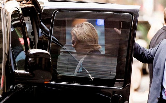 Democratic presidential candidate Hillary Clinton gets into a van as she leaves an apartment building Sunday, Sept. 11, 2016, in New York. Clinton's campaign said the Democratic presidential nominee left the 9/11 anniversary ceremony in New York early after feeling "overheated." (AP Photo/Andrew Harnik) Democratic presidential candidate Hillary Clinton gets into a van as she leaves an apartment building Sunday, Sept. 11, 2016, in New York. Clinton's campaign said the Democratic presidential nominee left the 9/11 anniversary ceremony in New York early after feeling "overheated." (AP Photo/Andrew Harnik)