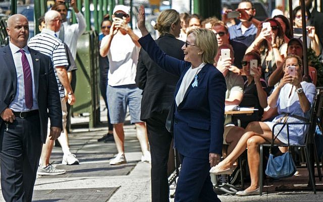 Democratic presidential candidate Hillary Clinton walks out of her daughter's apartment building, Sunday, Sept. 11, 2016, in New York. (AP Photo/Craig Ruttle)