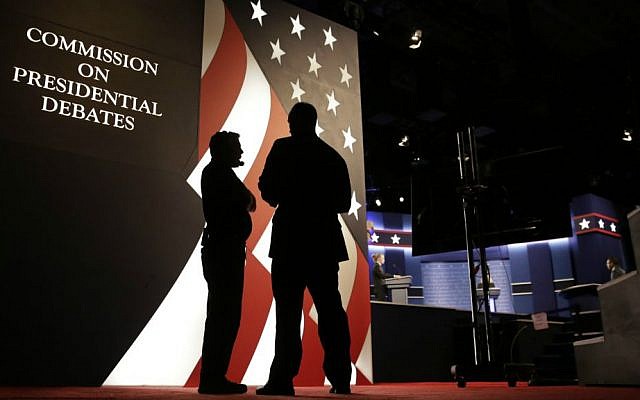 Producers stand next to the stage for the presidential debate between Democratic presidential candidate Hillary Clinton and Republican presidential candidate Donald Trump at Hofstra University in Hempstead, New York, Monday, Sept. 26, 2016. (AP Photo/David Goldman)