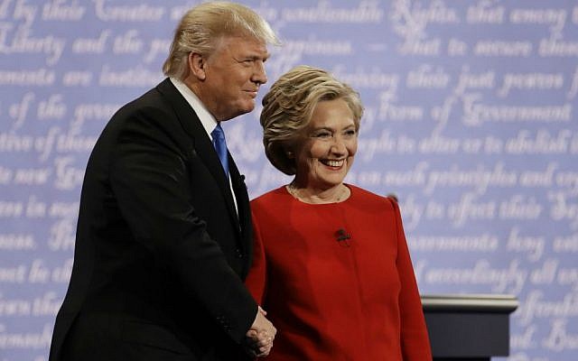 Democratic presidential nominee Hillary Clinton shakes hands with Republican presidential nominee Donald Trump during the presidential debate at Hofstra University in Hempstead, New York, Monday, Sept. 26, 2016. (AP Photo/Julio Cortez)