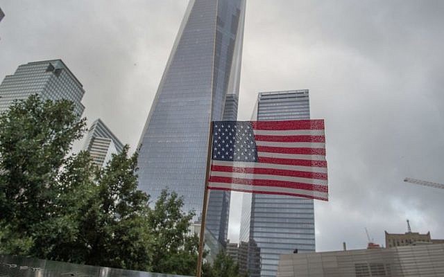 In this Sept. 11, 2015 file photo, a flag is placed along the South Pool prior to a ceremony at the World Trade Center site in New York. (AP/Bryan R. Smith) In this Sept. 11, 2015 file photo, a flag is placed along the South Pool prior to a ceremony at the World Trade Center site in New York. (AP/Bryan R. Smith)