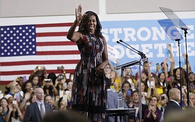 First lady Michelle Obama waves during a campaign rally in support of Democratic presidential candidate Hillary Clinton and vice presidential candidate, Sen. Tim Kaine, D-Va., Friday, Sept. 16, 2016, at George Mason University in Fairfax, Va. (AP Photo/Manuel Balce Ceneta)