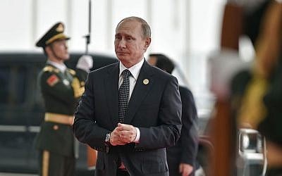 Russian President Vladimir Putin arrives at the Hangzhou Exhibition Center to participate in G-20 Summit in Hangzhou, China, September 4, 2016. (Etienne Oliveau/Pool Photo via AP)