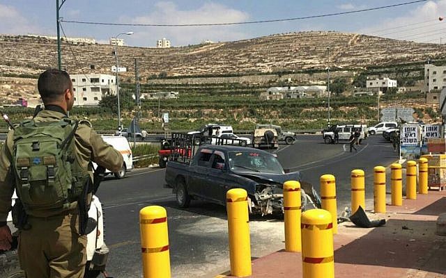 The scene of an apparent car ramming attack outside the Kiryat Arba settlement near the West Bank city of Hebron on September 16, 2016. (Judea and Samaria Hatzalah) The scene of an apparent car ramming attack outside the Kiryat Arba settlement near the West Bank city of Hebron on September 16, 2016. (Judea and Samaria Hatzalah)
