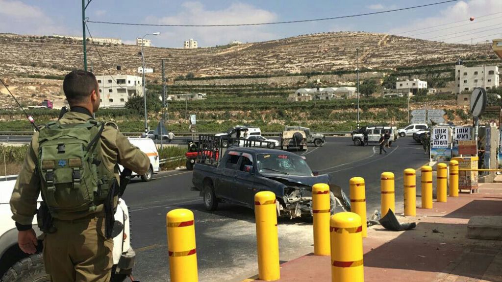 The scene of an apparent car ramming attack outside the Kiryat Arba settlement near the West Bank city of Hebron on September 16, 2016. (Judea and Samaria Hatzalah) The scene of an apparent car ramming attack outside the Kiryat Arba settlement near the West Bank city of Hebron on September 16, 2016. (Judea and Samaria Hatzalah)