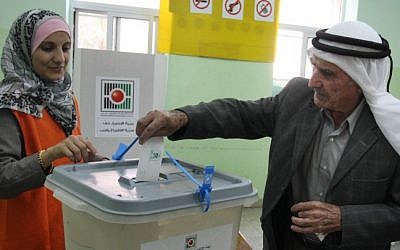 Illustrative: A Palestinian man casts his vote in the municipal elections in the West Bank town of Al-Bireh on October 20, 2012. (Issam Rimawi/Flash90)