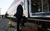 Benjamin Netanyahu boards a train from Tel Aviv to Beersheba on November 13, 2012. (Kobi Gideon/GPO/Flash90)